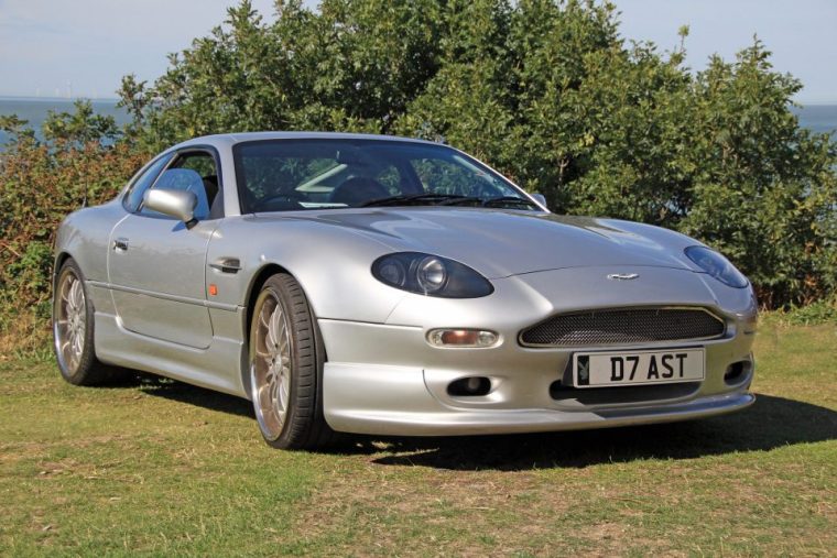 A technician inspecting the brake system of an Aston Martin at All European | Auto Repair Las Vegas in Nevada.